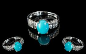 Turquoise and White Zircon Ring, an oval cut cabochon of over 2cts of the bright, matrix free,