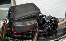 Minolta Dynax 5000i Camera, in fitted black carry case with shoulder strap, and spare film.