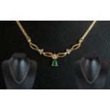 9ct Gold Necklace, set with an Emerald & Diamond drop.