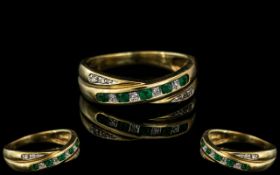 9ct Emerald & Diamond Dress Ring, set with alternating emeralds and diamonds, on a twist style.