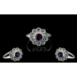 9 ct Gold Amethyst Set Dress Ring, flower head setting set with white sparkly stones.