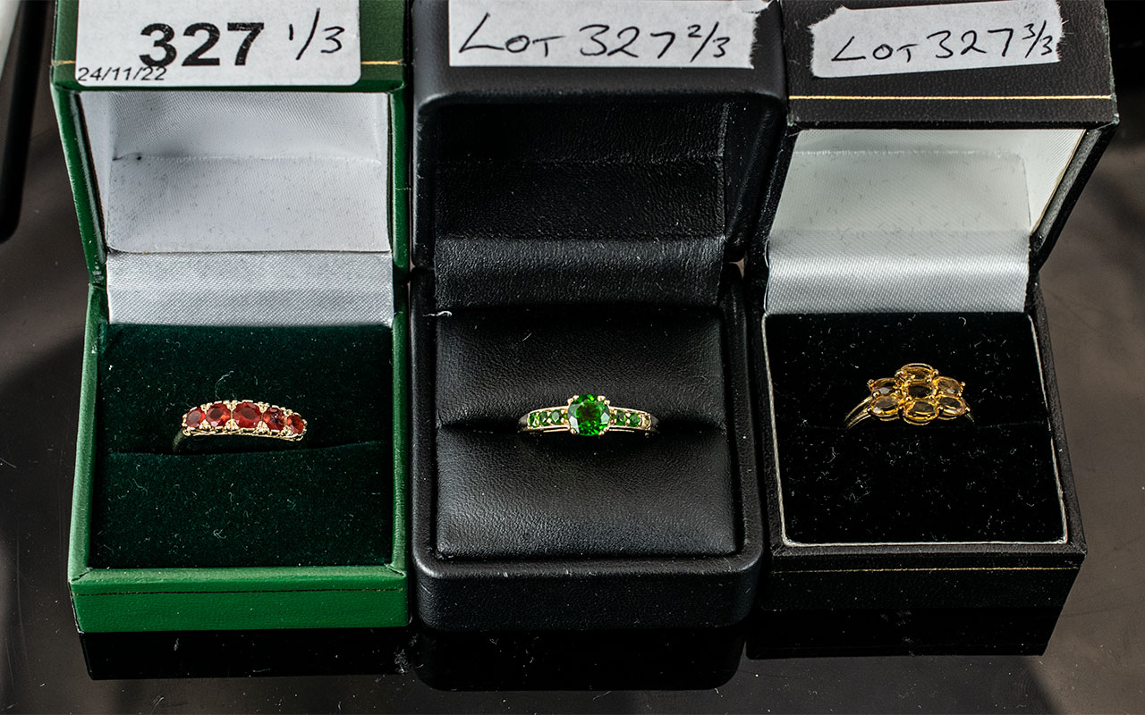 Three 9ct Gold Dress Rings, set with Citrine, Garnet and green Tourmaline coloured stones.