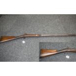 A 19th Century Percussion Riffle Walnut Stock With Ramrod, Steel Mounts. Overall length 48 inches.