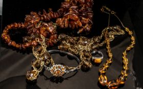 Collection of Amber Coloured Jewellery, including necklaces, bracelet and ring.