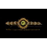 Antique Period 9ct Gold Peridot Set Brooch, Ornate Setting. Marked 9ct. Weight 2.7 grams.