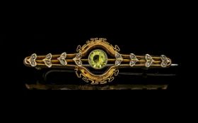 Antique Period 9ct Gold Peridot Set Brooch, Ornate Setting. Marked 9ct. Weight 2.7 grams.