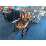Traditional Oak Rocking Chair with spindle back and carved centre panel.