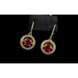 Ruby 'Moving Gemstone' Drop Earrings, with an unusual suspended setting for each 1.