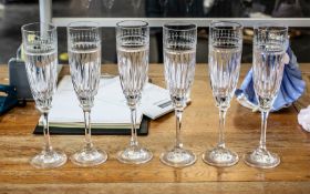 Six Tall Glass Champagne Flutes, with floral etching to top and star cut glass bowl,