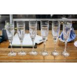 Six Tall Glass Champagne Flutes, with floral etching to top and star cut glass bowl,