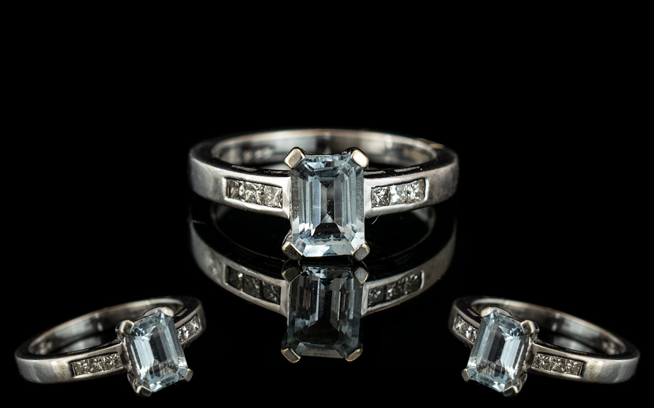 9ct White Gold Aquamarine & Diamond Ring, set with a central step cut Aquamarine,