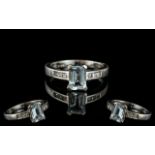 9ct White Gold Aquamarine & Diamond Ring, set with a central step cut Aquamarine,