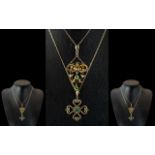 9ct Gold Edwardian Pendant, set with three green coloured gemstones,