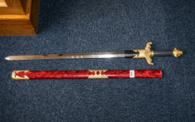 Decorative Oriental Fantasy Display Sword in red case, with gold handle. Measures 35" length.
