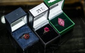 Collection of Three 9ct Gold Dress Rings set with red faceted stones, look to be Ruby and Garnet.