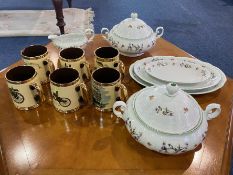 A Small Collection Of Porcelain comprising, six drinking tankards, three serving platters,