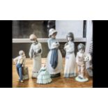 Collection of Six Porcelain Figures, comprising a Nao figure of a girl with a puppy, 9.5'' tall, a