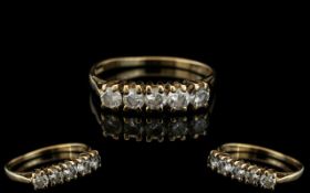 A 9ct Gold Dress Ring Set With 5 CZ's.