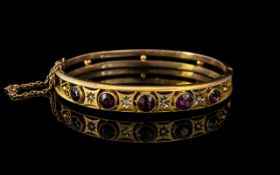 Ladies 9ct Gold and Garnet and Diamonds Bangle With Safety Chain. Approx Size 6.5 by 5 cms.