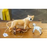 Three Beswick Figures, comprising a lioness measuring 6" tall x 9" long, a fox measuring 2.
