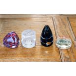 Four Paperweights, including Wedgwood, Caithness, clear dice design, and one other.