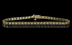 A 14ct Gold Diamond Tennis Bracelet Set With 46 Round Modern Brilliant Cut Diamonds.