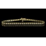 A 14ct Gold Diamond Tennis Bracelet Set With 46 Round Modern Brilliant Cut Diamonds.