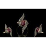 Antique Style Dress Ring, set with a central cabochon Ruby, surrounded by rose cut diamonds,