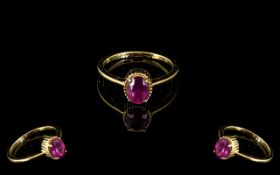 Ruby Solitaire Ring, an oval cut solitai