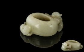 A Brush Pot in White Jade depicting a bo