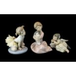 Three Lladro Figures, comprising No. 5728 'Heavenly Dreamer', a small angel sleeping, No. 1451, '