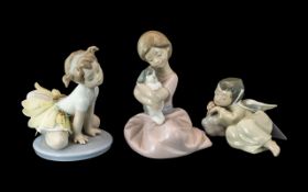Three Lladro Figures, comprising No. 5728 'Heavenly Dreamer', a small angel sleeping, No. 1451, '