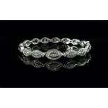 Ladies 18ct White Gold Attractive Diamond Set Bangle (hinged), marked 750 - 18 ct. The diamonds