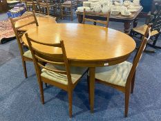 1960's Extendible Teak Table & Chairs, table of oval shape, measures 54'' x 38'', height 29''.