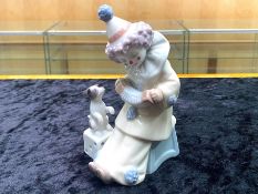 Lladro Pierrot Clown with Puppy & Concertina. No. 5279. Dated 1984, measures 6'' tall.