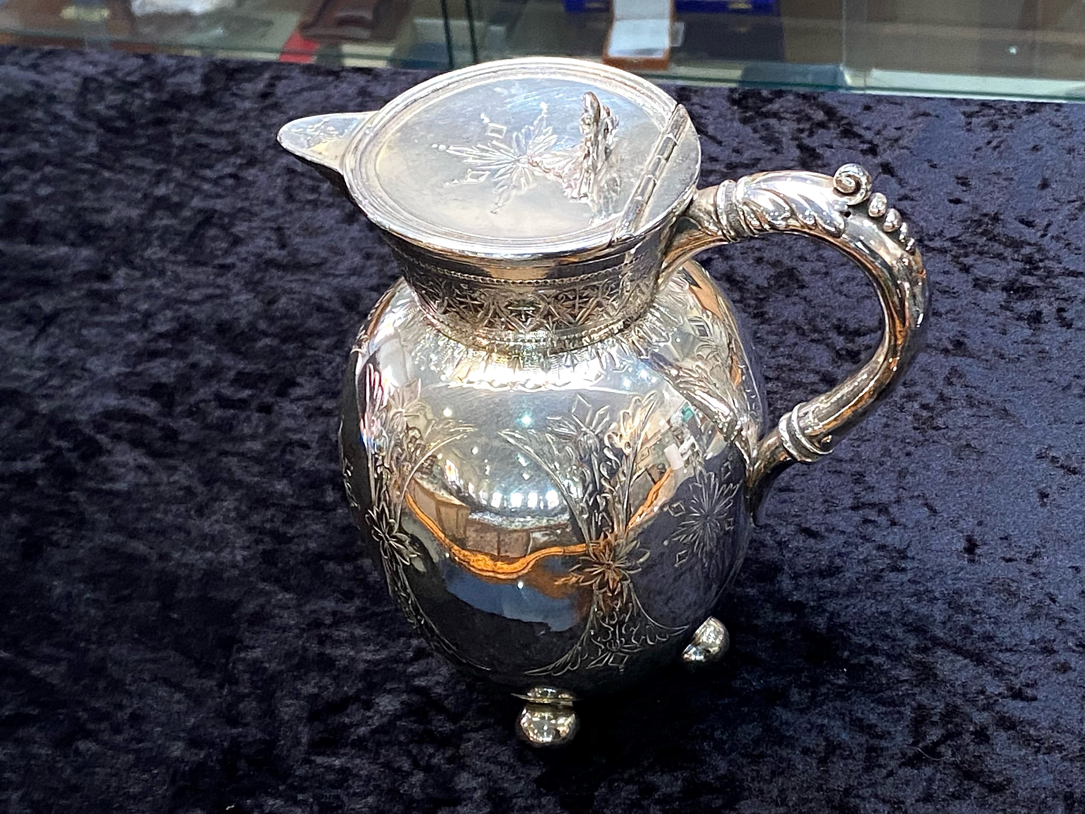 A Victorian Silver Plated Water Jug, raised on cannonball feet, with etched decorations. Height - Image 2 of 6
