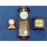 Collection of Clocks, comprising a Hermle cased pendulum glass fronted wall clock, white dial, Roman