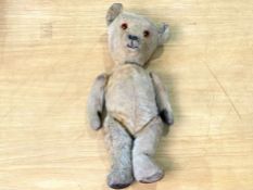 Early 20th Century Jointed Teddy Bear with padded feet and paws, glass eyes and straw filled, 16