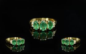 14ct Gold - Attractive Emerald and Diamond Set Ring. Marked 14ct to Interior of Shank. The Oval