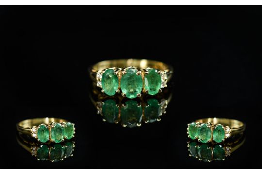 14ct Gold - Attractive Emerald and Diamond Set Ring. Marked 14ct to Interior of Shank. The Oval