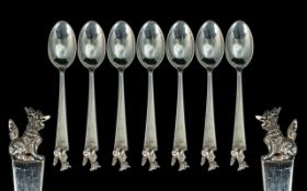 A Set of Seven Chinese Silver Spoons, with dog of Foo finial, unmarked, tests silver. Weight 131