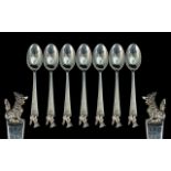 A Set of Seven Chinese Silver Spoons, with dog of Foo finial, unmarked, tests silver. Weight 131