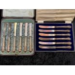 Two Edwardian Silver Butter Knives in original fitted ,cases, one set with silver blades and