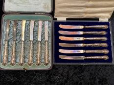 Two Edwardian Silver Butter Knives in original fitted ,cases, one set with silver blades and