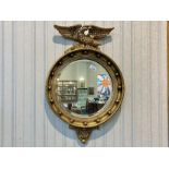 Gilt Empire Style Wall Mirror, eagle crest to top, measures 27'' high x 18'' wide.