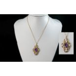 A Fine Quality 9ct Gold Openworked Amethyst and Pearl Set Pendant, of elaborate form, with