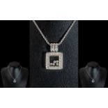 An 18ct White Gold Pendant & Chain, in the style of Chopard floating diamonds style, the pendant