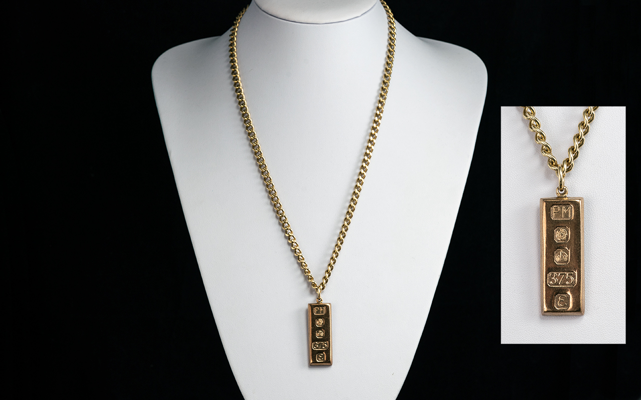1oz 9ct Gold Ingot, attached to a heavy 9ct Gold Curb Chain. Both hallmarked for 9.375, ingot