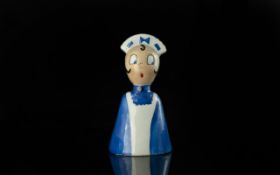 Art Deco Carlton Ware Novelty Table Top Bell in the form of a cheeky nurse, dressed in vibrant blue;