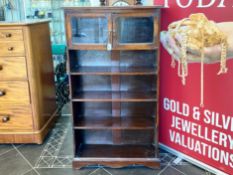 Early 20th Century Oak Bookcase, glazed top above four open shelves. Measures 54'' tall, 28'' wide